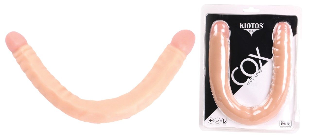 U-förmiger Dildo in Hautfarbe. Auf Blisterverpackung mit Logo KIOTOS und Schriftzug COX.