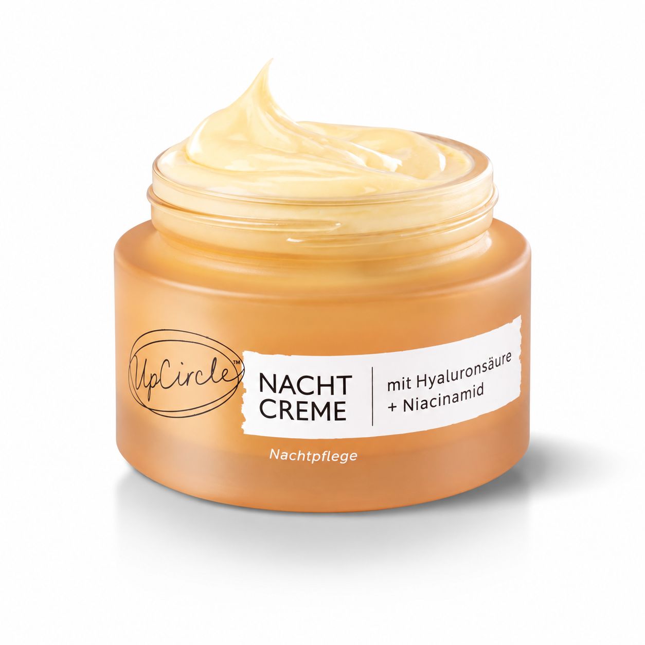 UpCircle Nachtcreme in einem bernsteinfarbenen Glas mit Deckel.