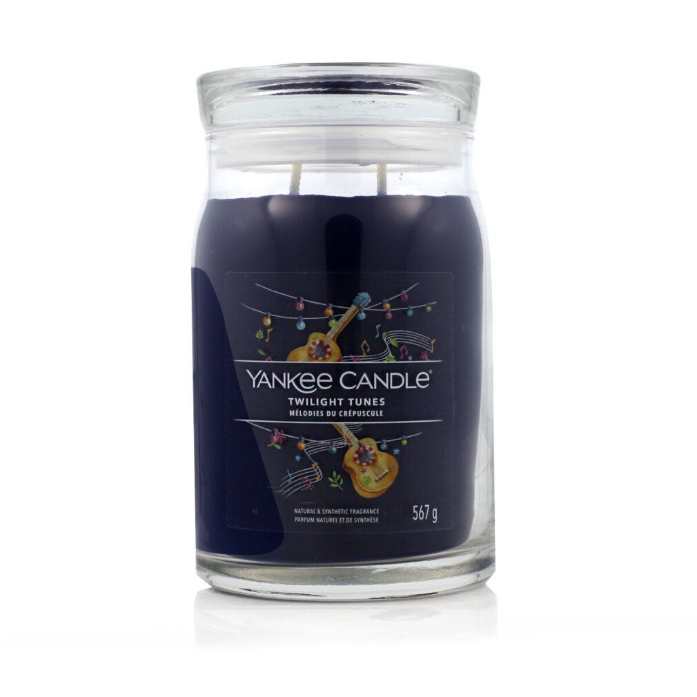 Duftkerze im Glas mit Deckel. Aufschrift: Yankee Candle Twilight Tunes. Abbildung von Musikinstrumenten. 567 g.