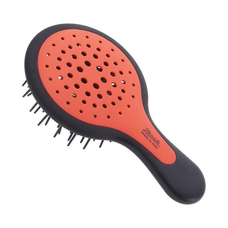 Haarbürste, oval, schwarz-orange. Griff mit Logo. Schwarze Borsten. Made in Italy.