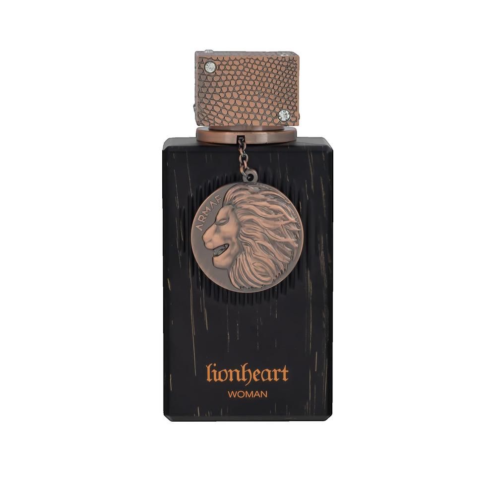 Dunkelbraune rechteckige Flasche mit kupferfarbenem Deckel und Anhänger mit Löwenrelief. Aufschrift: lionheart woman.