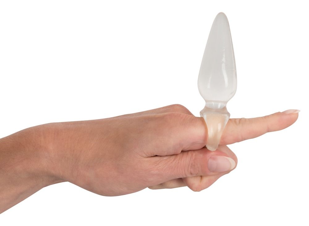 Finger Plug aus transparentem, flexiblem TPR auf einem Finger getragen. 9,5 cm Länge, 2,7 cm Durchmesser.
