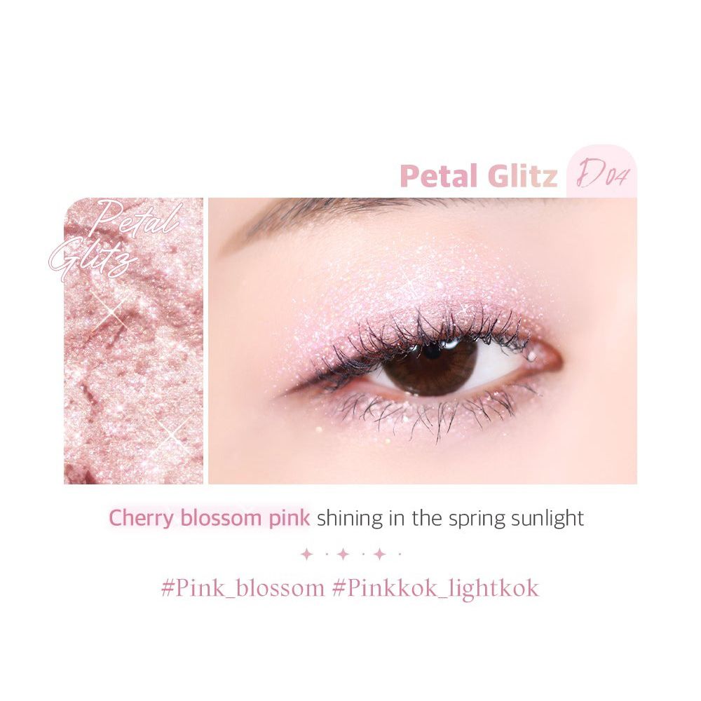 Auge mit rosa Lidschatten. Text: Petal Glitz D04. Text: Cherry blossom pink shining in the spring sunlight.