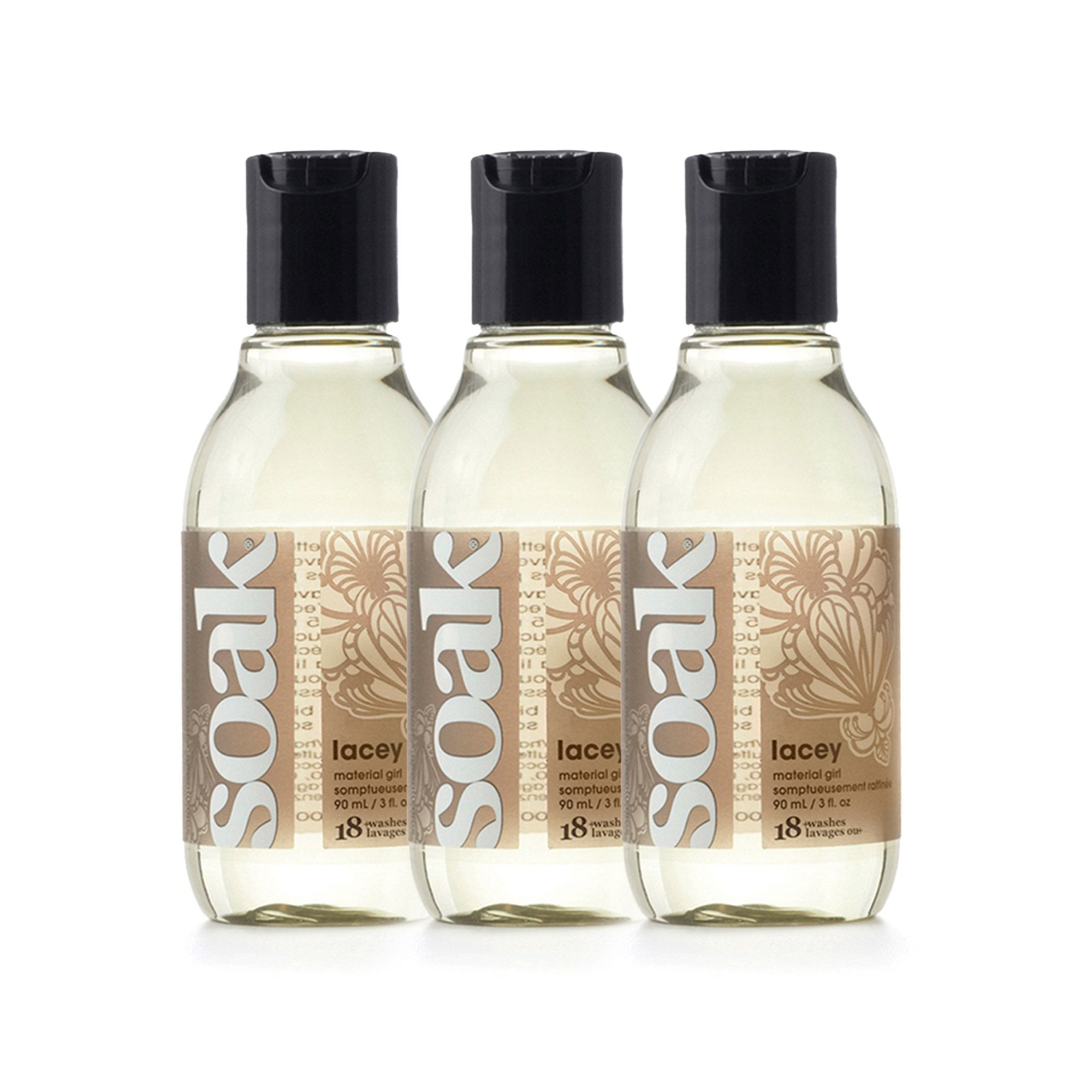 Drei Flaschen mit schwarzen Deckeln und Etiketten. Aufschrift: soak, lacey, Waschmittel. 90 ml.