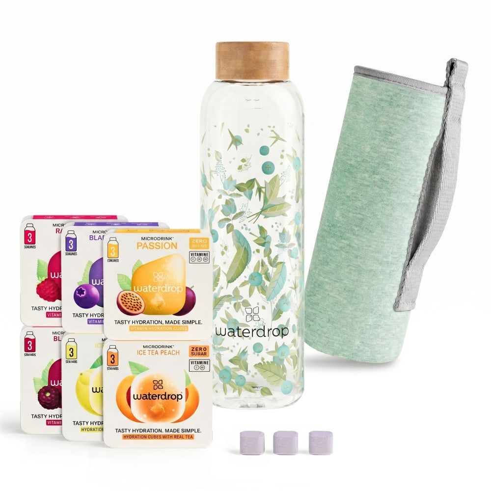 Glasflasche mit Holzdeckel, Hülle und Tabletten. Sechs Packungen mit Wasserdrop-Würfeln. Floral bedruckt.