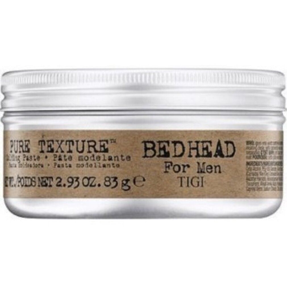 Zylindrische Dose mit silberfarbenem Deckel. Braunes Etikett mit "PURE TEXTURE" und "Bed Head For Men TIGI". Text in Englisch, Spanisch und Französisch.
