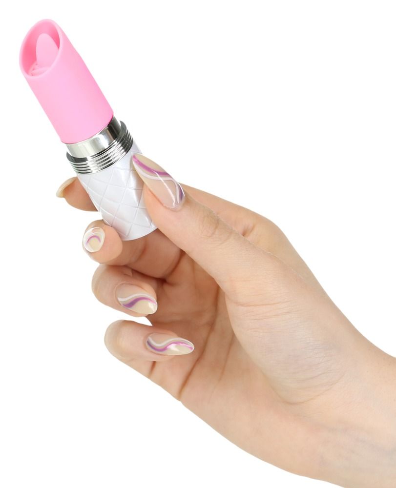 Hand hält einen Lippenstift-Vibrator in Weiß und Rosa mit Rautenmuster.