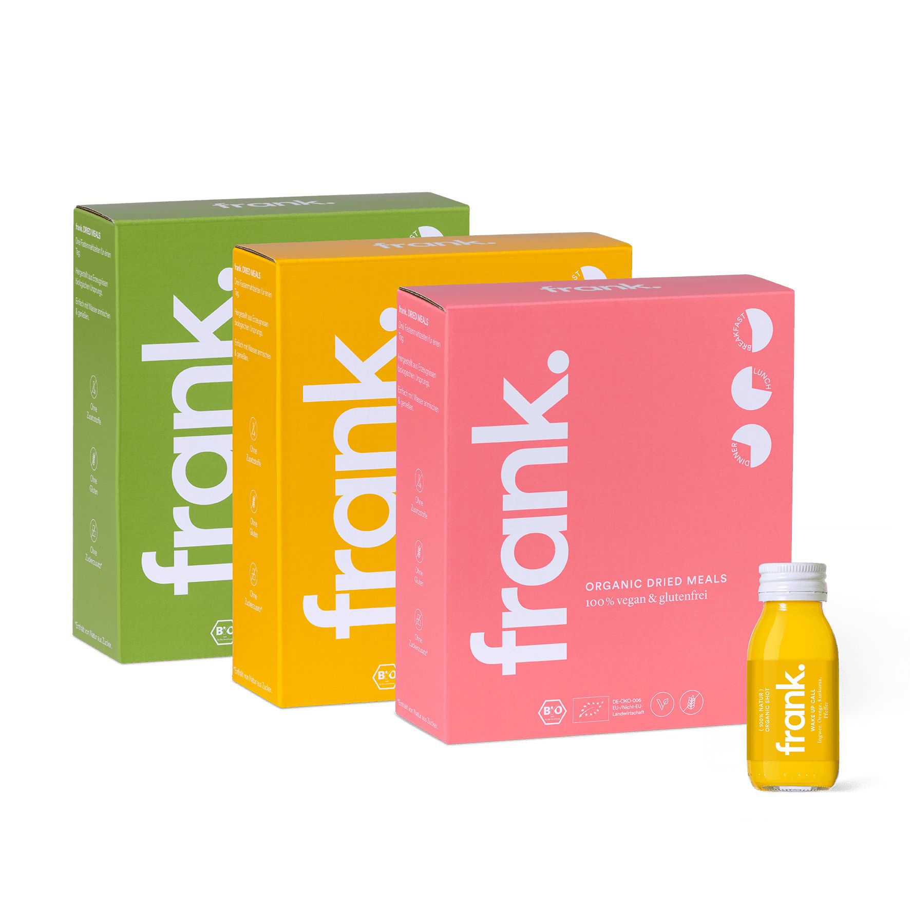 Drei rechteckige Kartons und eine Flasche mit gelber Flüssigkeit. Auf den Kartons steht "frank."