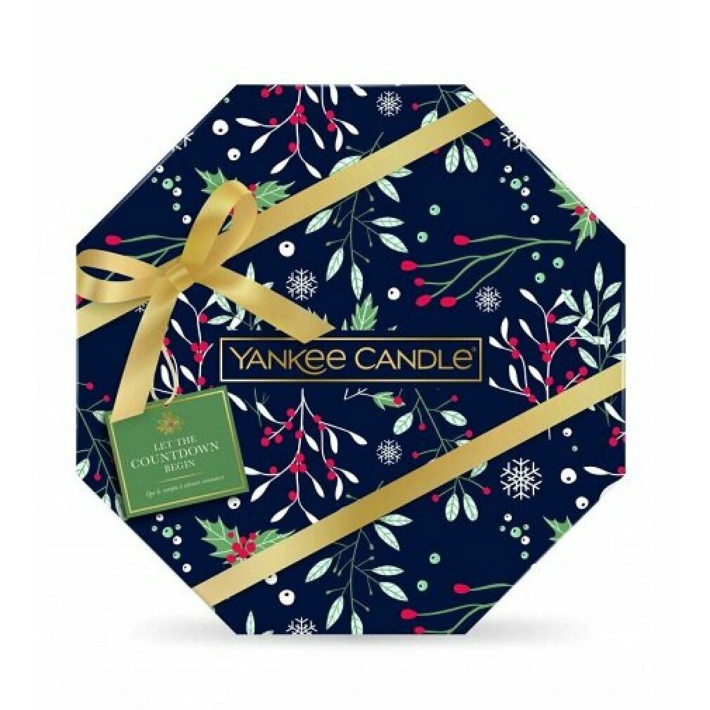 Achteckige Geschenkbox mit goldener Schleife und floralem Muster. Logo und Anhänger mit Text.