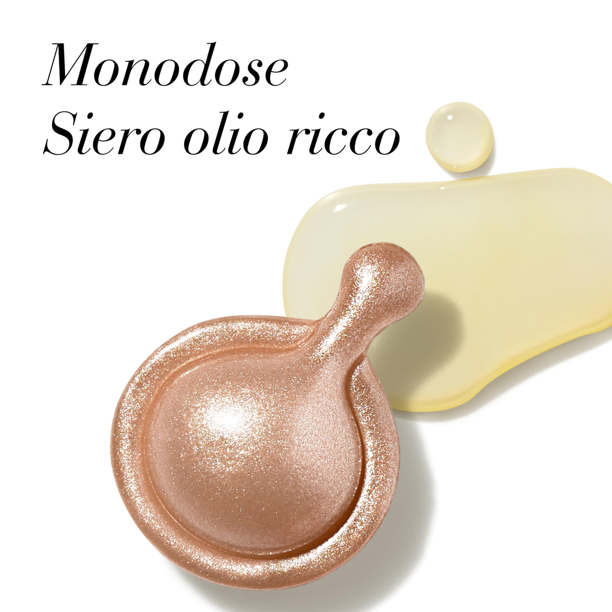 Nahaufnahme einer goldenen Kapsel und Serum. Text: Monodosis, Siero olio ricco.