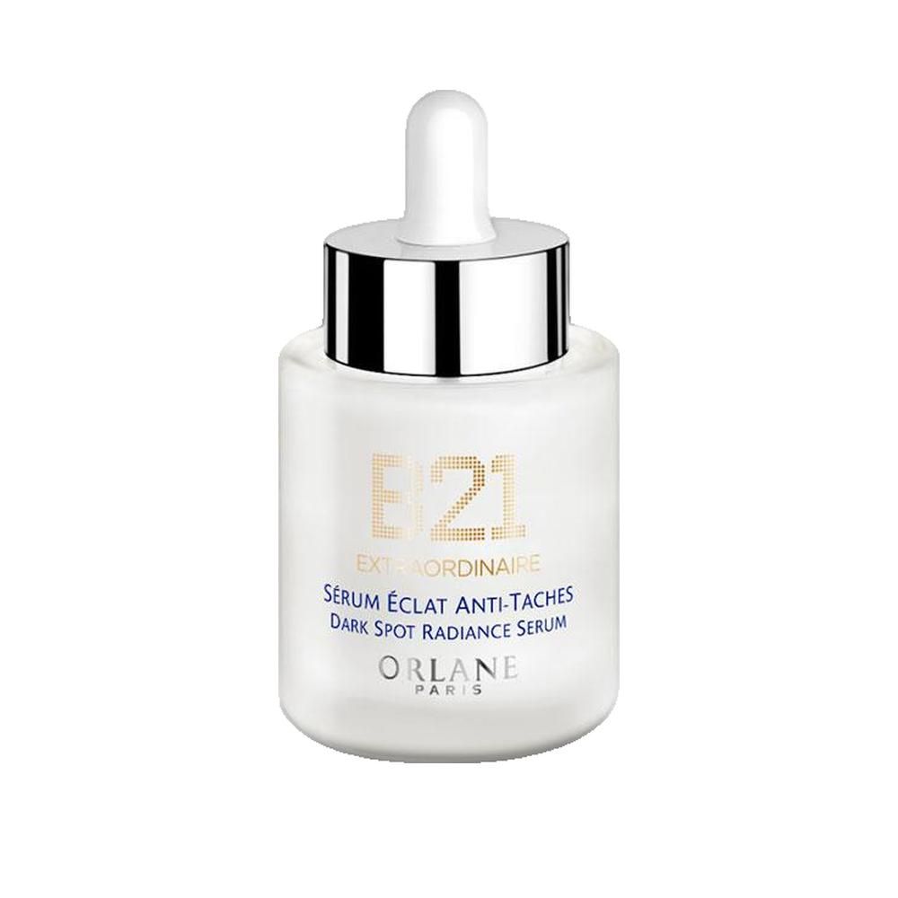 Weißes Serumfläschchen mit silbernem Deckel und Pipette. Beschriftung: B21 Extraordinaire, Sérum Éclat Anti-Taches, Dark Spot Radiance Serum. Marke: Orlane Paris.