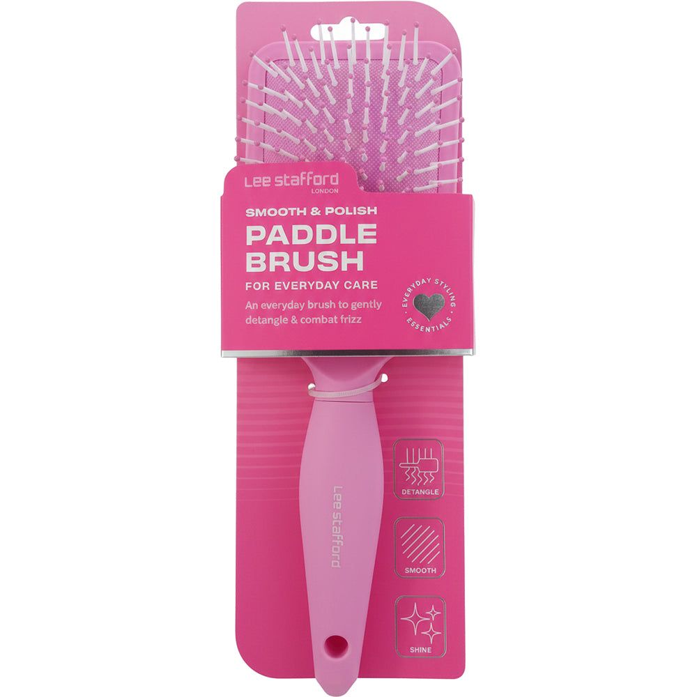 Rosa Paddle Brush in Verpackung. Produktname und Markenname sind sichtbar. Verpackung mit Produktinformationen.