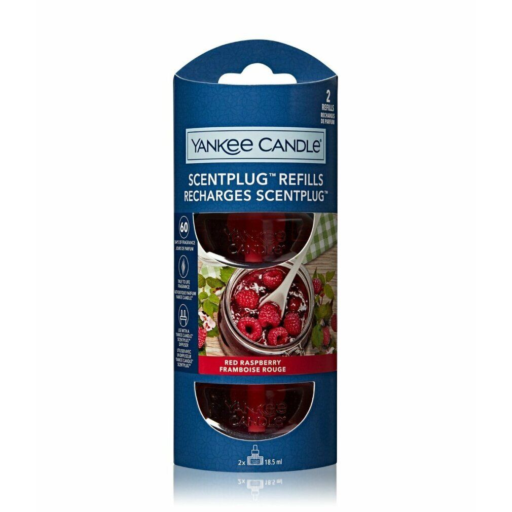 Yankee Candle Scentplug Nachfüllung, rote Himbeere. Zwei Nachfüllungen in blauer Verpackung. Produktabbildung mit Himbeeren.