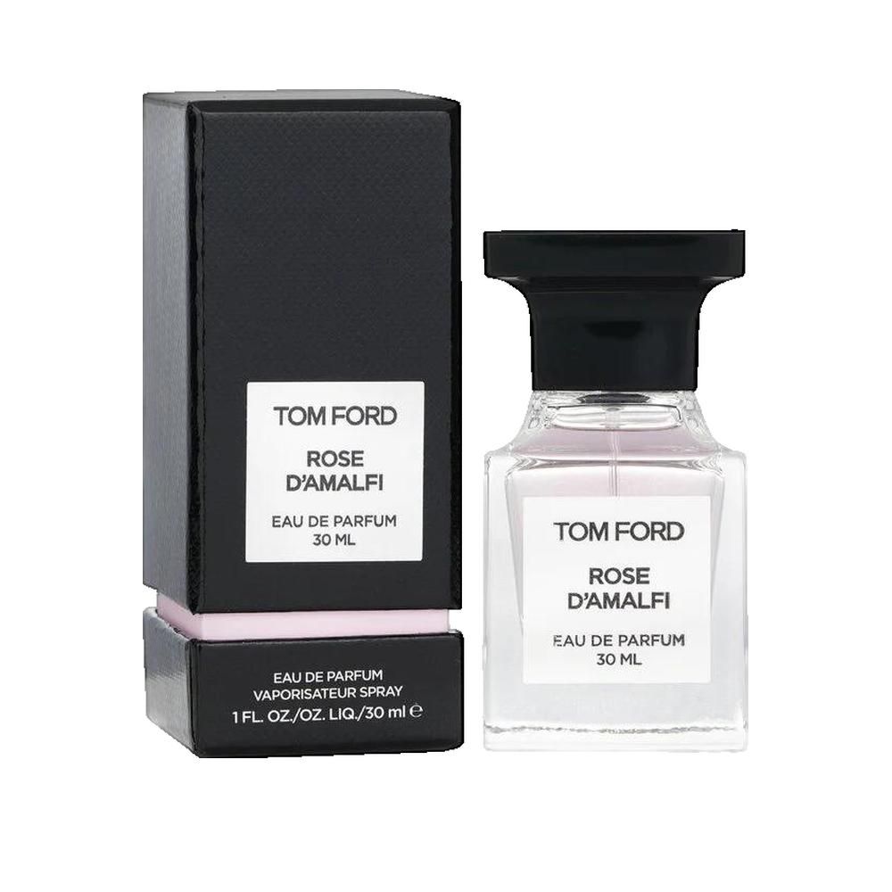 Parfumflakon und Verpackung. Schwarze Schachtel mit weißem Etikett. Schriftzug: Rose D'Amalfi.