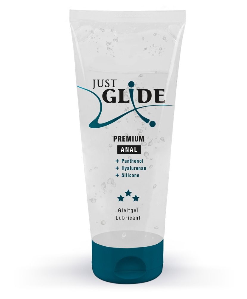 Transparentes Gleitgel in einer Tube. Aufschrift: JUST GLIDE PREMIUM ANAL. Enthält Panthenol, Hyaluronan, Silikon. Blaue Verschlusskappe.