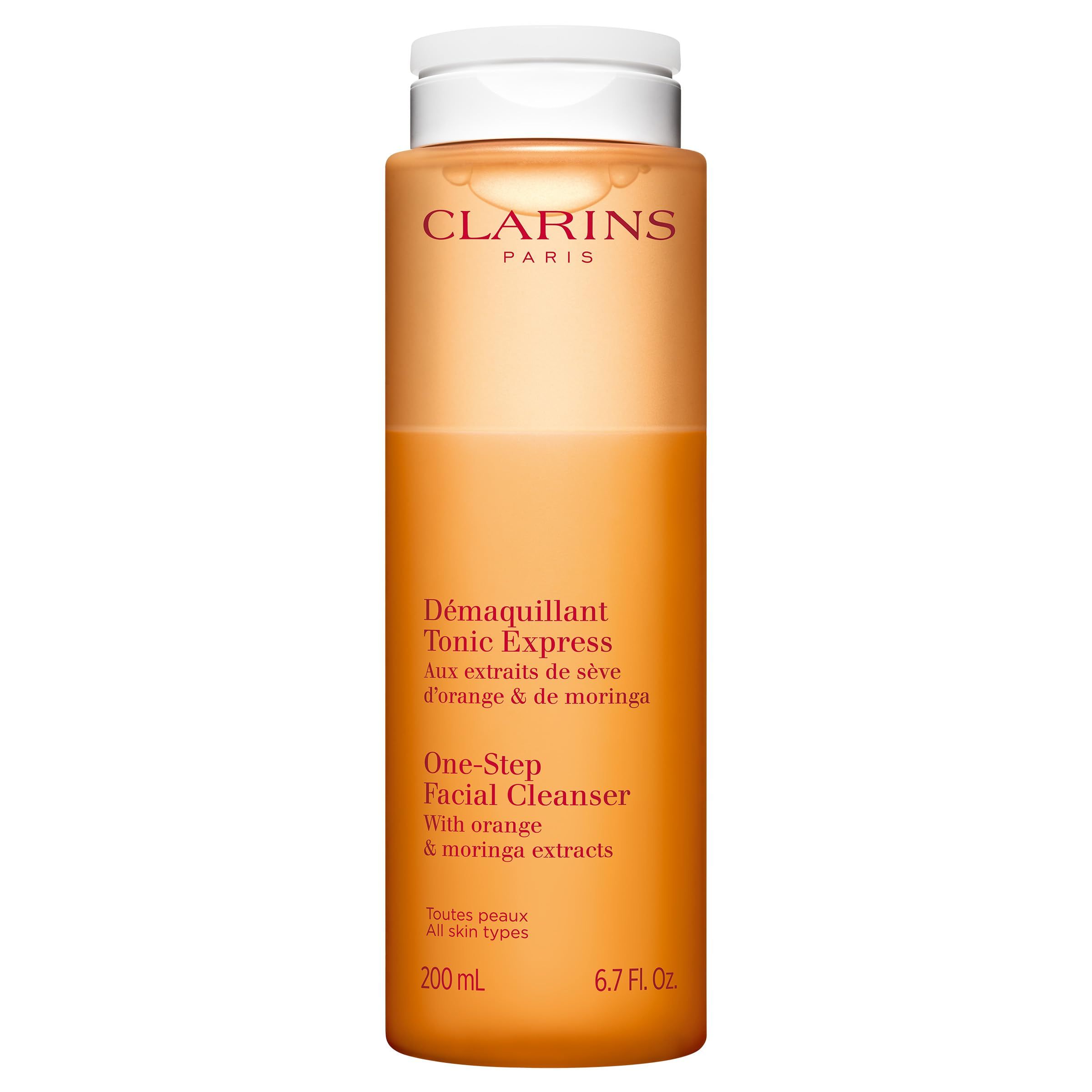 Orangefarbene Flasche mit weißem Deckel. Aufschrift: Clarins Paris, D
emaquillant Tonic Express, One-Step Facial Cleanser.