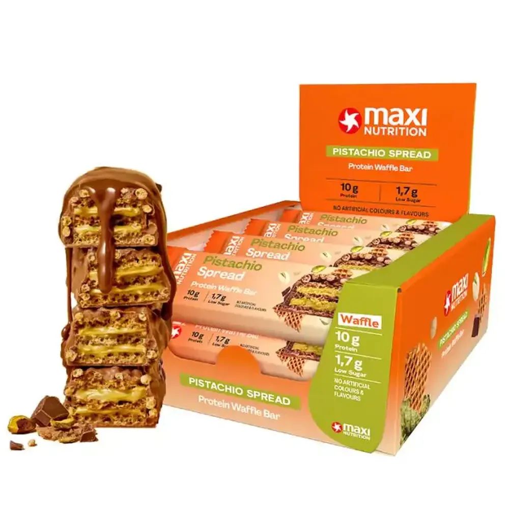 MaxiNutrition Protein Waffle Bar, Pistachio Spread. Einzelne Riegel und Verpackung. 12er-Box. Sichtbare Nährwertangaben.