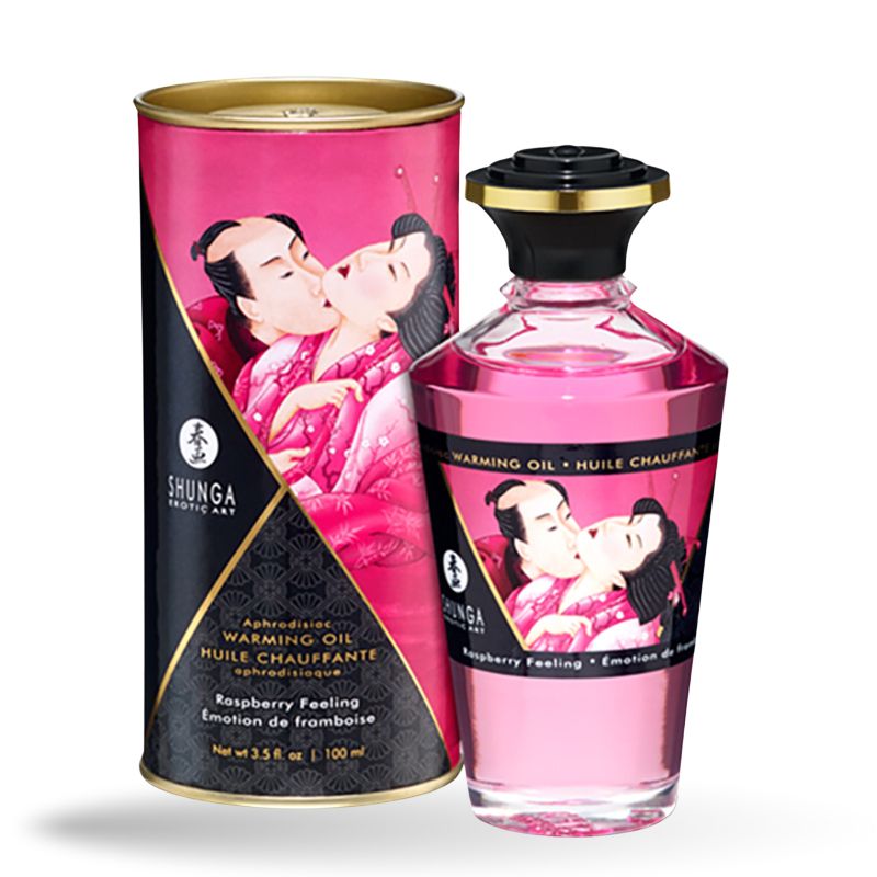 Glasflasche und Dose mit Etiketten. Aufschrift: Shunga, Warming Oil, Himbeer-Aroma. Abbildung: küssendes Paar.