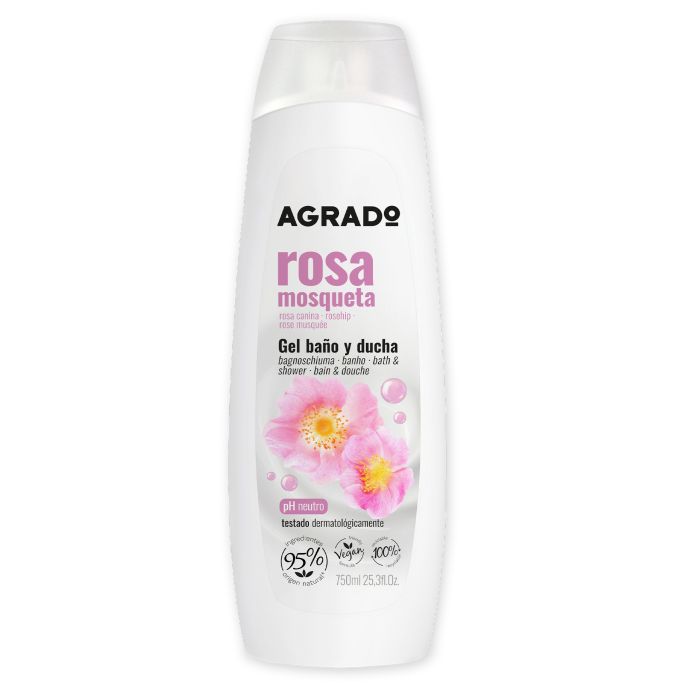 Weiße Flasche mit rosa Etikett. Aufschrift: AGRADO, rosa mosqueta, Gel baño y ducha. Abbildung von Rosenblüten. pH-neutral, vegan.