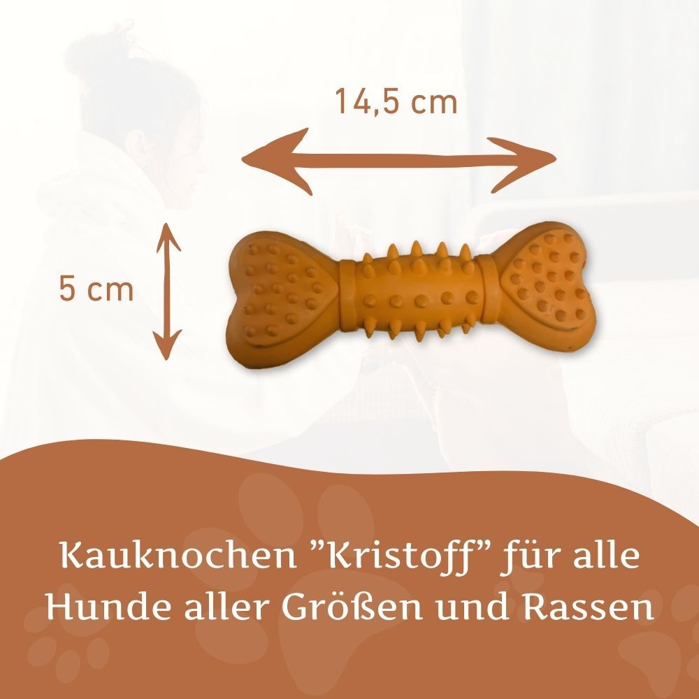 Ein orangefarbener Quietschknochen aus Naturkautschuk. Maße: 14,5 cm x 5 cm. Text: Kaukknochen "Kristoff" für alle Hunde.
