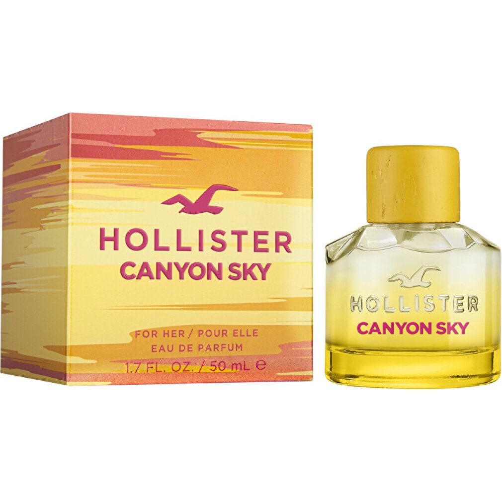 Flakon und Verpackung. Gelbes Parfum in Glasflakon mit gelbem Deckel. Verpackung mit Schriftzug Canyon Sky.