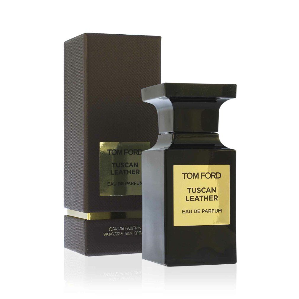 Schwarzer Flakon neben einer schwarzen Schachtel. Goldfarbenes Etikett mit Aufschrift: TOM FORD TUSCAN LEATHER.