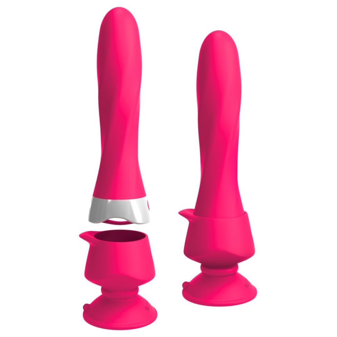 Zwei rosa Vibratoren mit Zubehör. Halterung und Basis. Auf weißem Hintergrund.