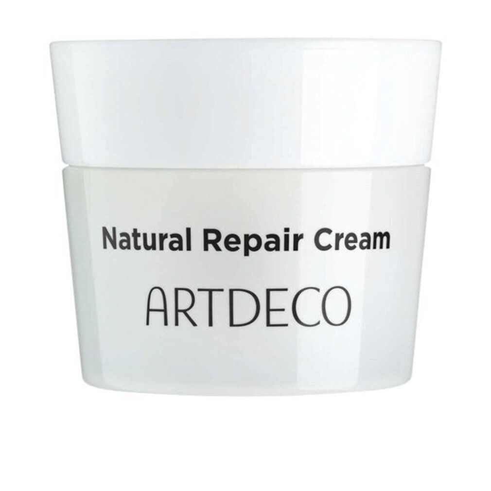 Weißer Tiegel mit Deckel. Aufschrift: Natural Repair Cream, ARTDECO. Produktverpackung.