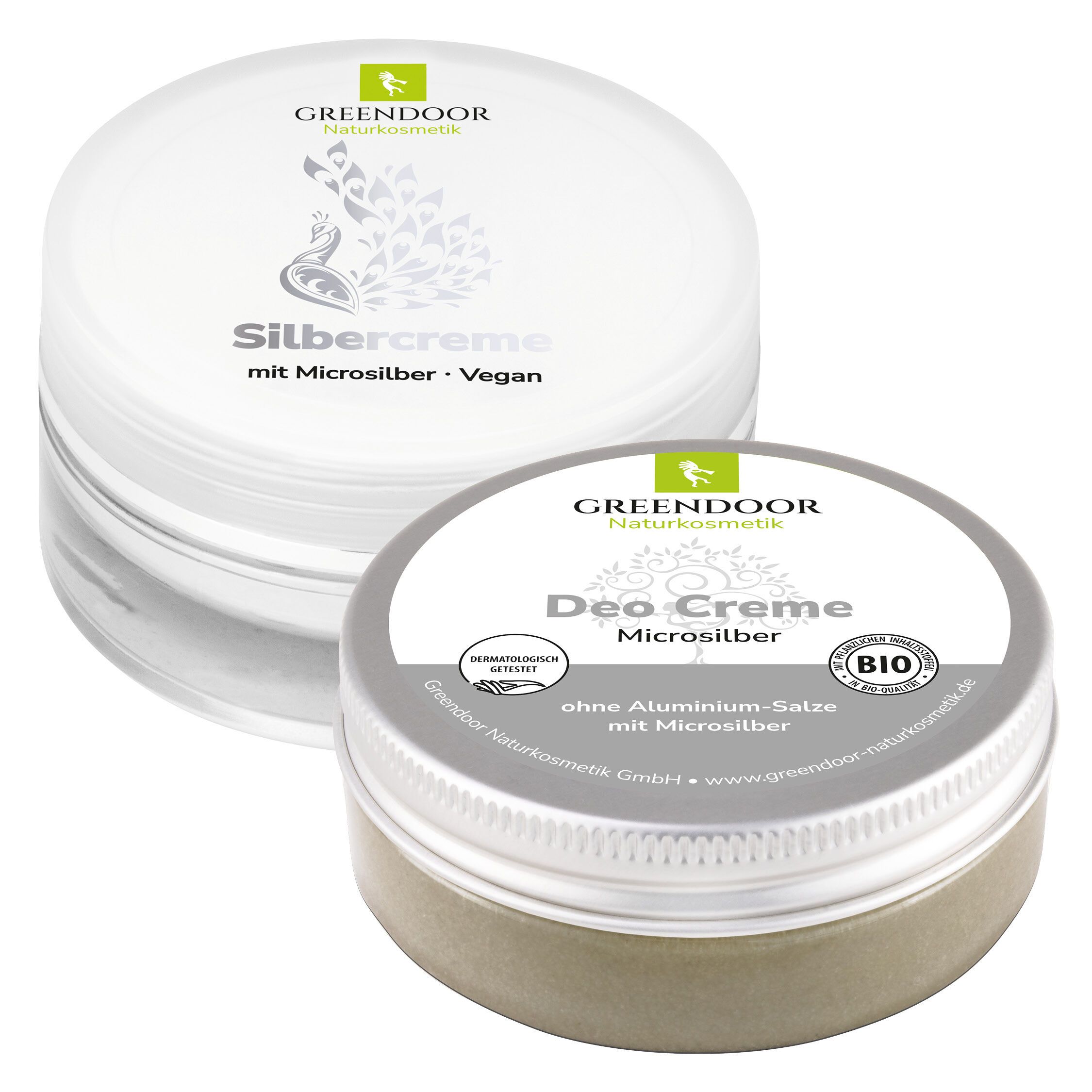 Zwei Cremetiegel. Der obere, weiß, trägt den Schriftzug "Silbercreme". Der untere, silberfarben, trägt die Aufschrift "Deo Creme". Beide haben einen Deckel.