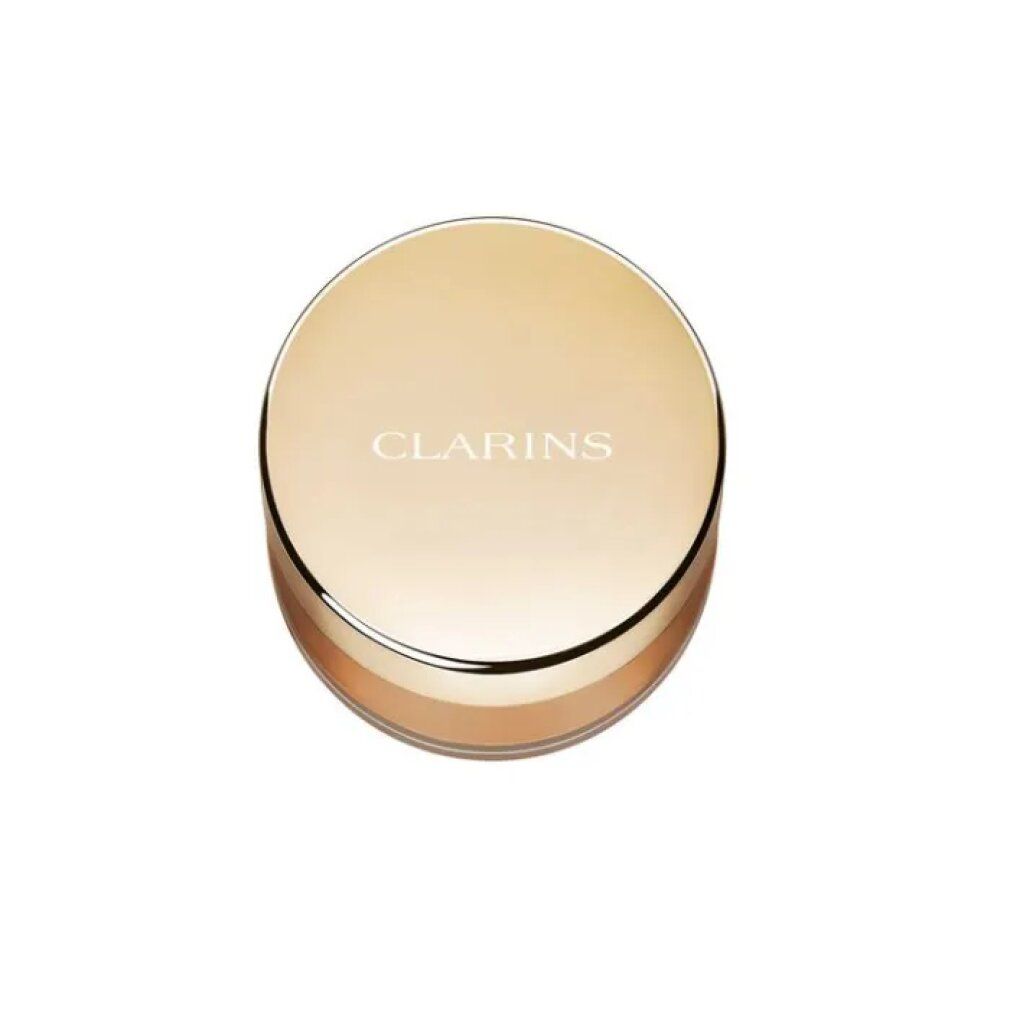 Goldener runder Behälter mit CLARINS-Logo. Sichtbarer Puder in hellem Braunton.