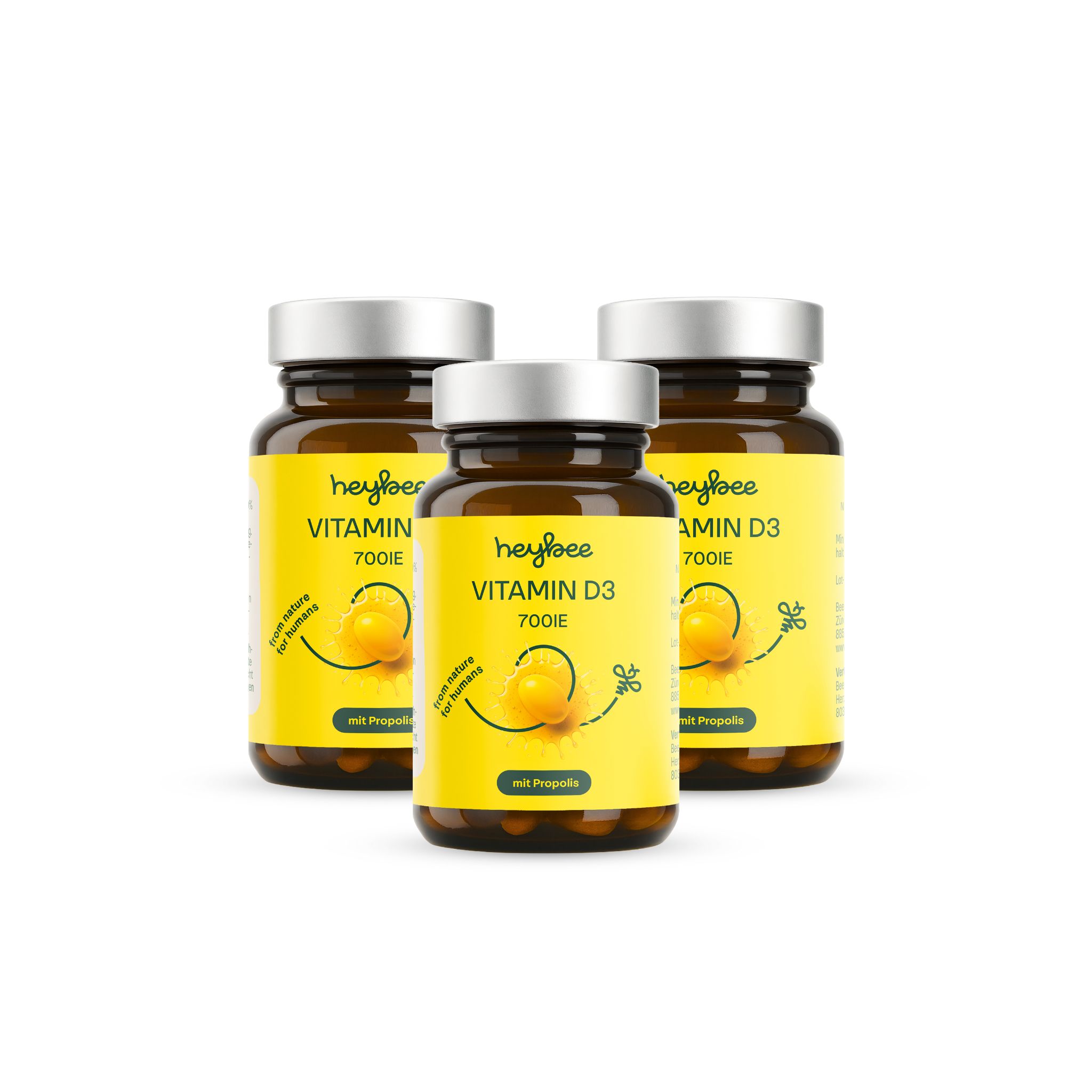 Drei Flaschen heybee Vitamin D3 700 I.E. + Propolis. Braune Glasflaschen mit gelben Etiketten. Deckel silberfarben.