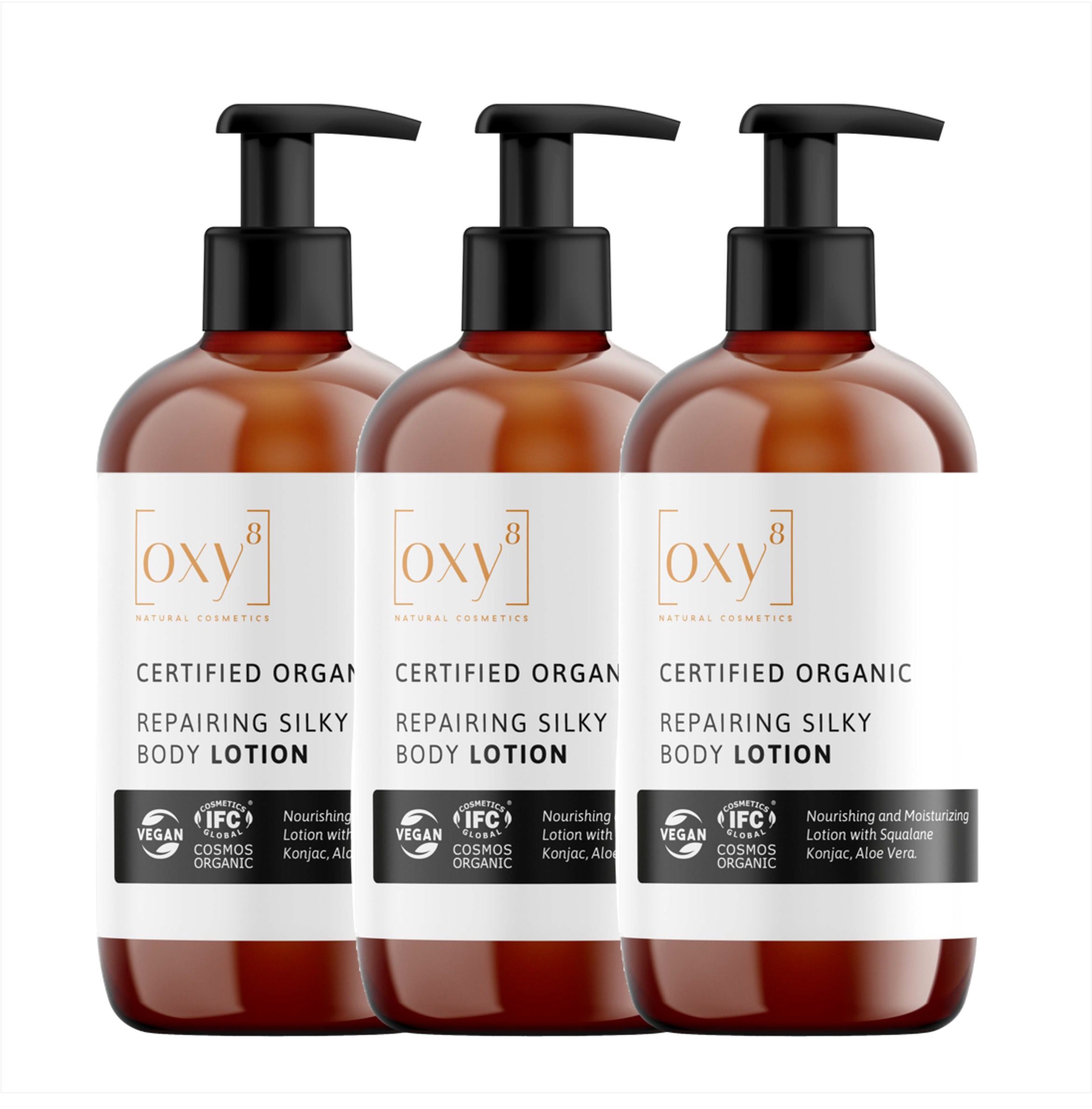 Drei Flaschen Repairing Silky Body Lotion mit schwarzen Pumpen. Aufschrift: oxy8, Certified Organic, Vegan, IFC.