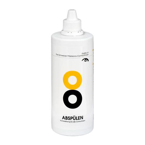 Weiße Flasche mit gelben und schwarzen Kreisen. Aufschrift: ABSPÜLEN. Text: Kochsalzlösung für alle Contactlinsen.