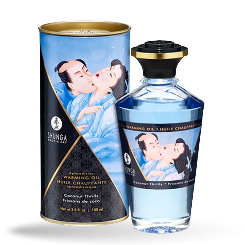 Zylindrische Dose und Flasche mit blauem Öl. Aufschrift: Shunga, Warming Oil, Coconut Thrills. Abbildung: küssendes Paar.
