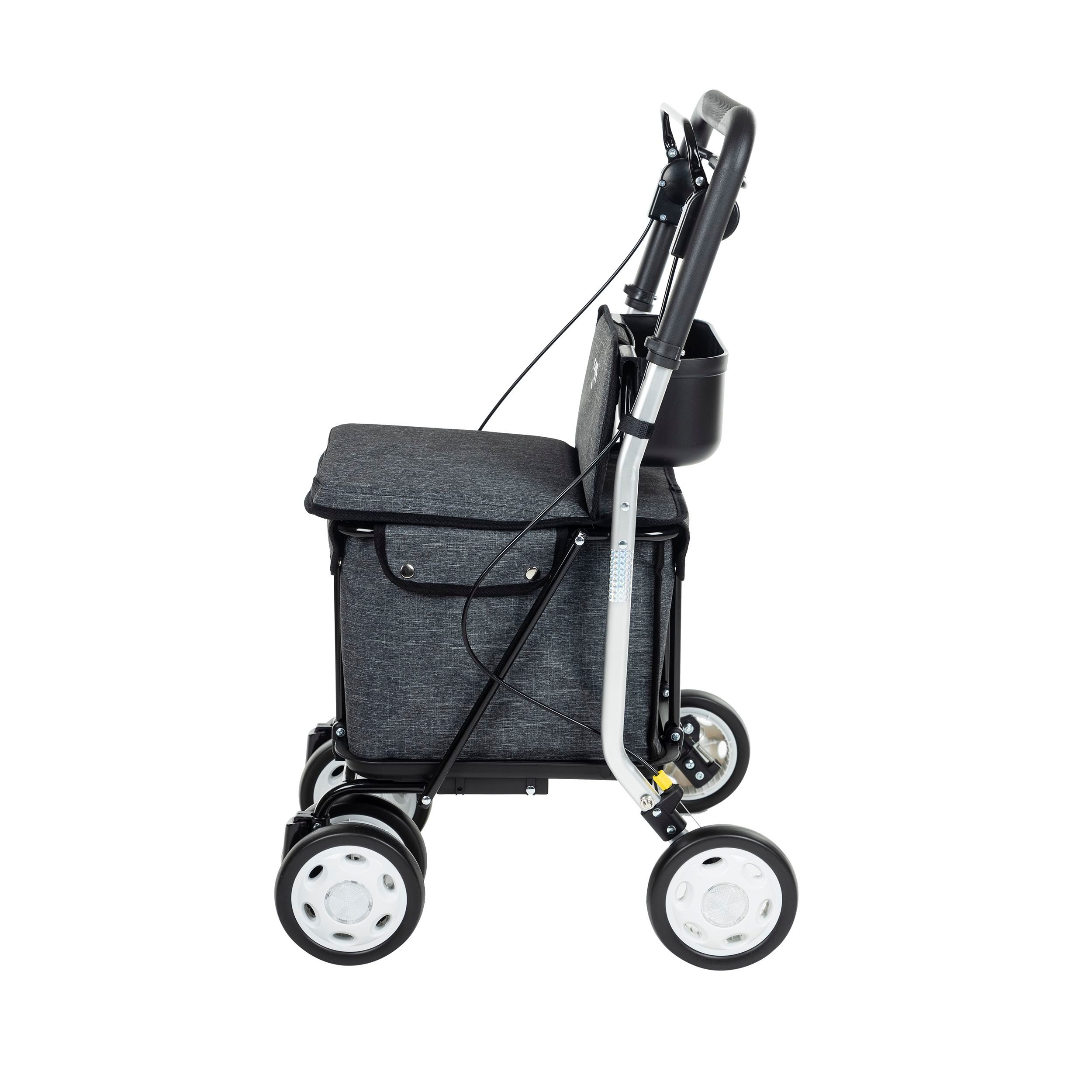 Carlett Comfort Einkaufstrolley, Seitenansicht. Grau, vier Räder, schwarzer Rahmen, Sitz und Tasche.