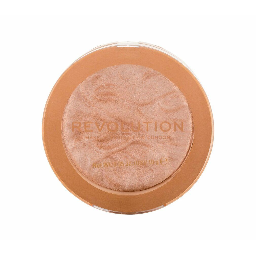 Runder Highlighter. Helle, goldfarbene Oberfläche. Umrandung in hellem Braun. Schriftzug: REVOLUTION. Net Wt. 0.35 oz (US) / 10 g e.
