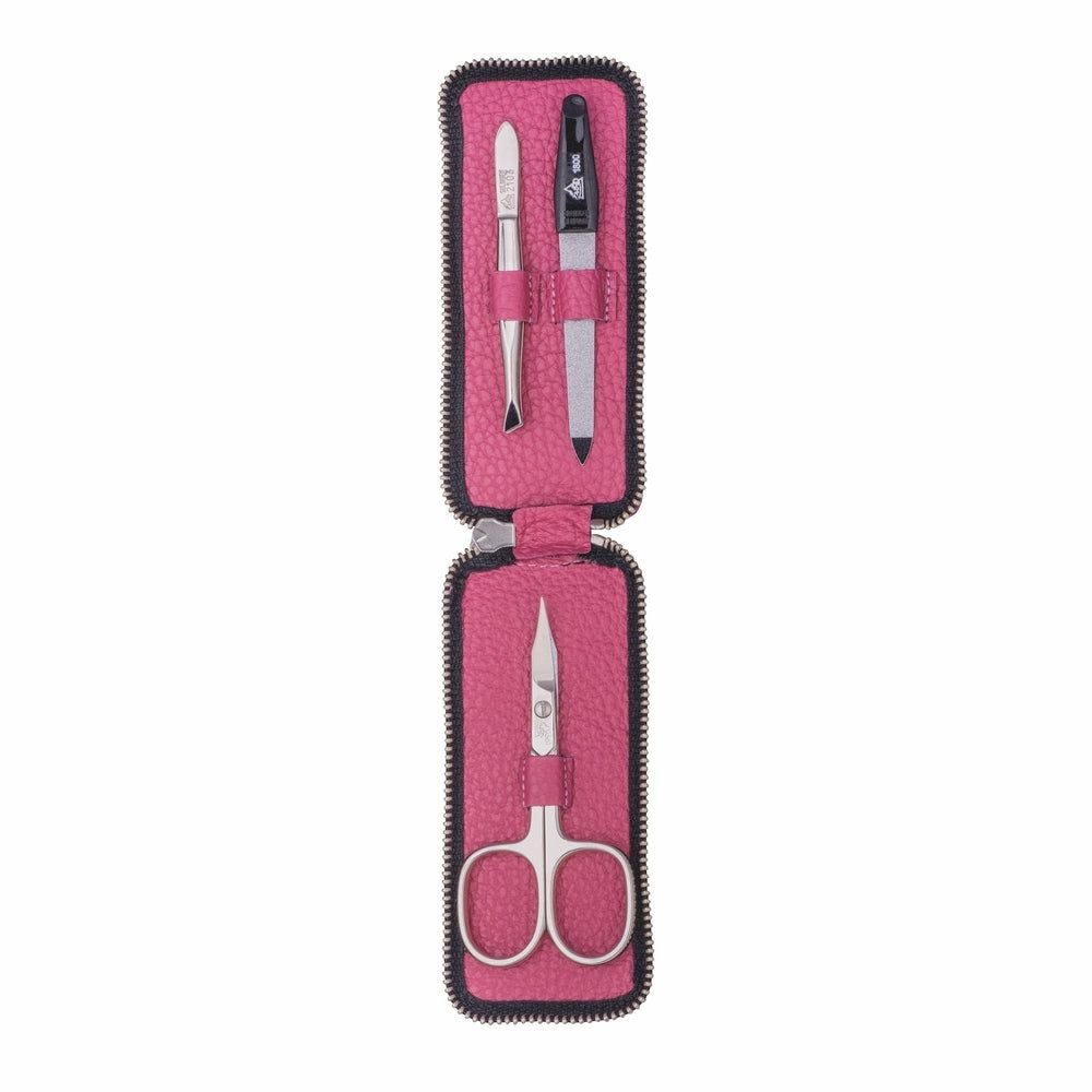 Etui mit Maniküre-Set. Enthält Nagelschere, Feile, Pinzette und Werkzeug. Rosa Leder, schwarzer Reißverschluss.