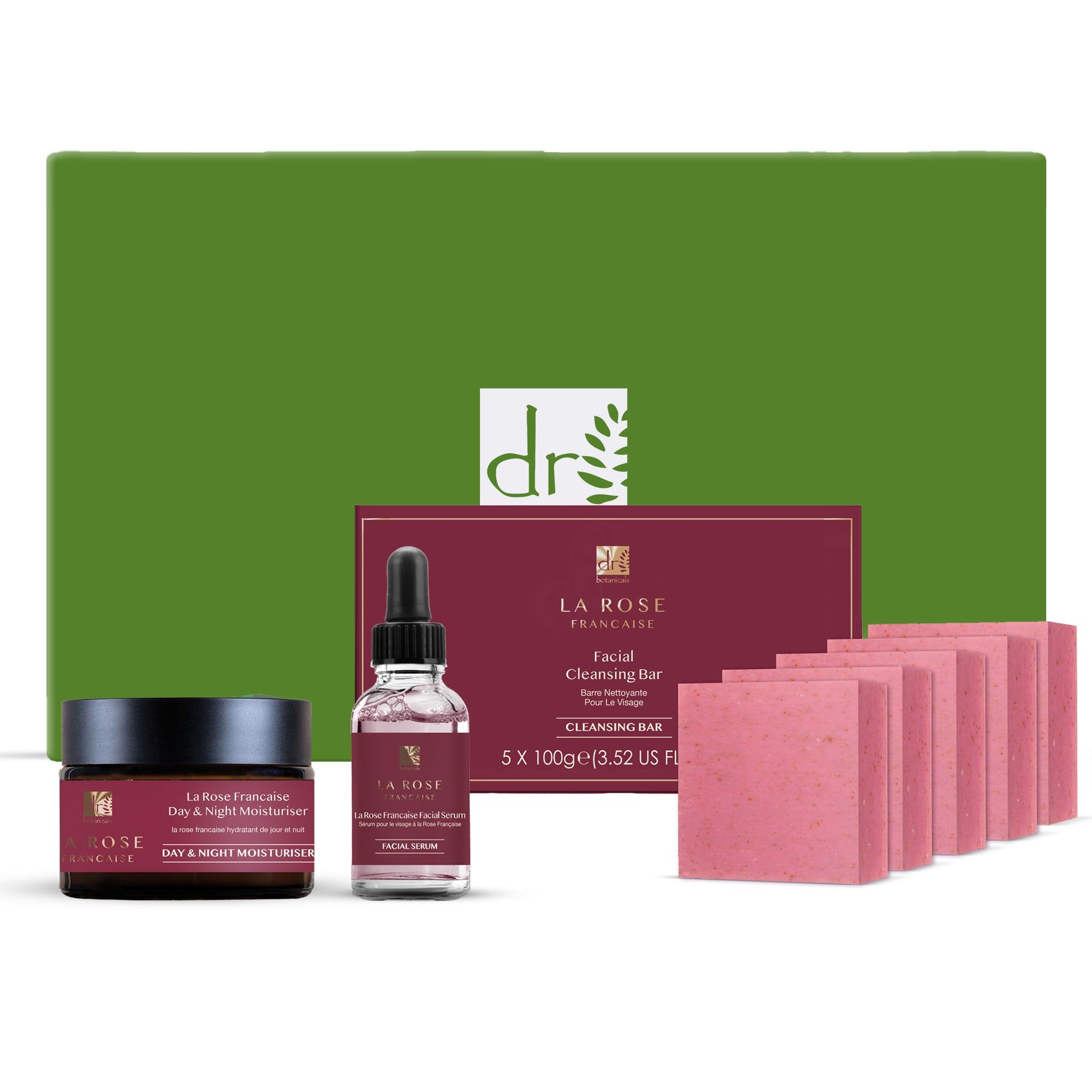 Geschenkset mit Hautpflegeprodukten. Enthält Creme, Serum, Reinigungsbarren und eine grüne Box mit Logo.