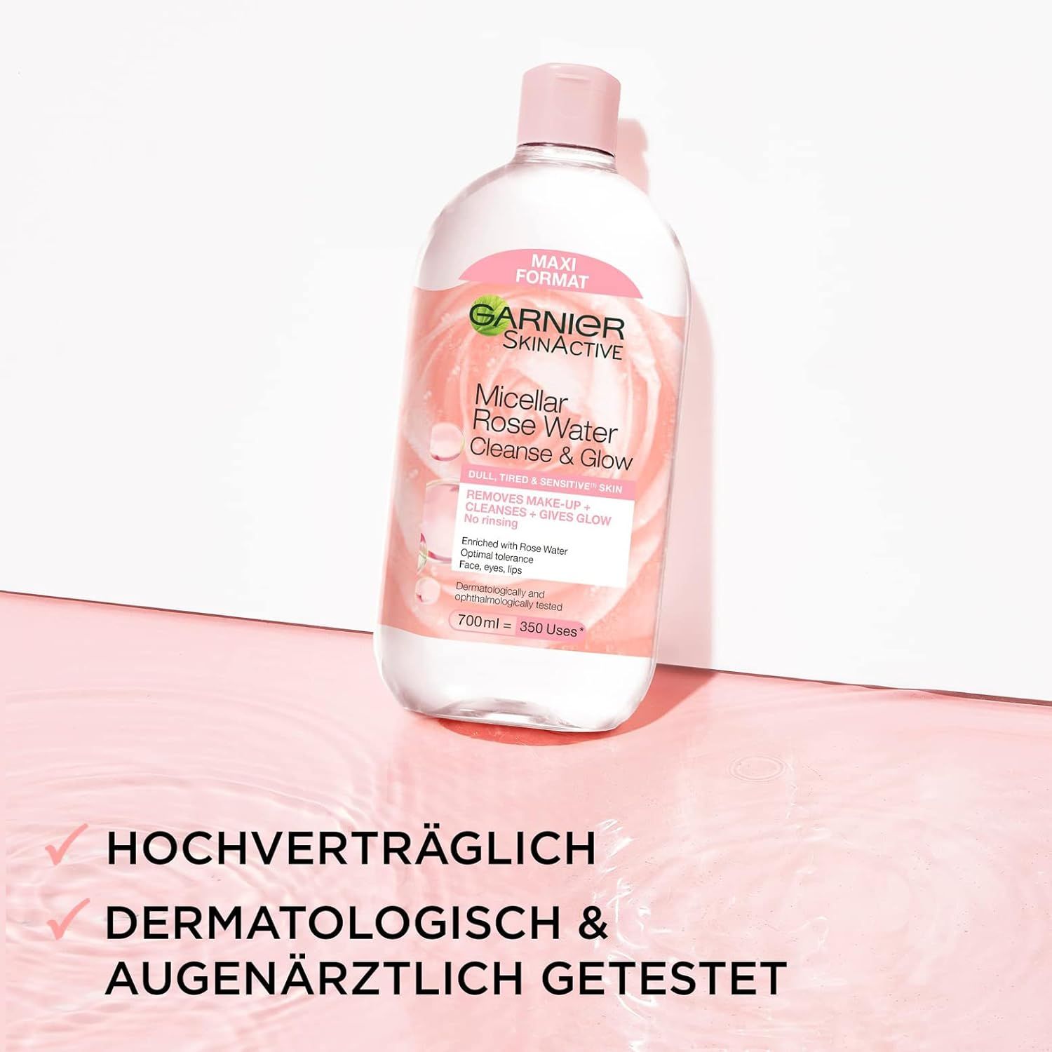 Klare Flasche mit rosa Flüssigkeit. Etikett mit Produktnamen, Marke Garnier SkinActive und Inhaltsstoffen. Rosa Deckel. Maxi-Format.