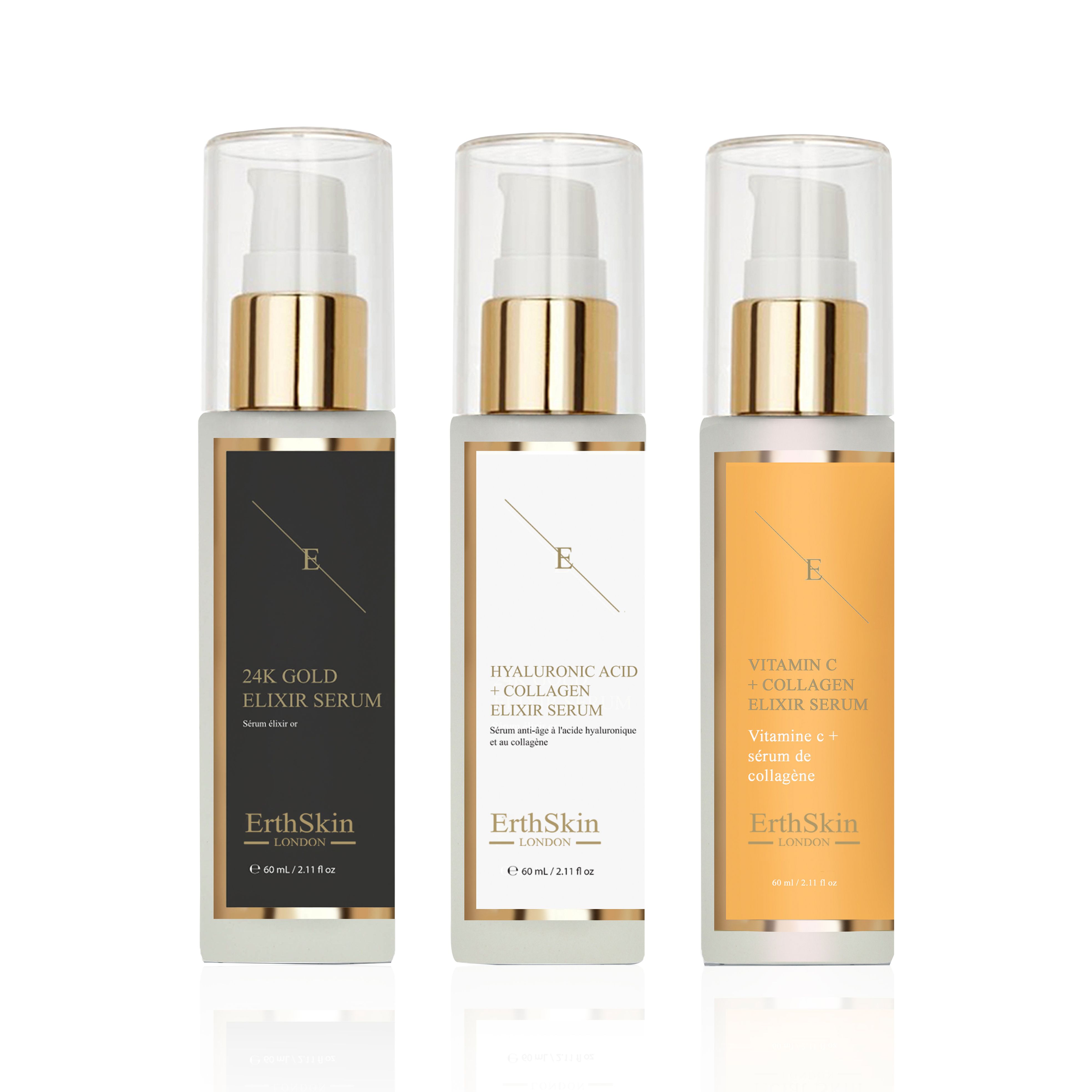 Drei Flaschen Serum. Jede Flasche hat eine goldene Pumpe und einen weißen oder farbigen Etikett. Auf den Etiketten steht "ErthSkin London".