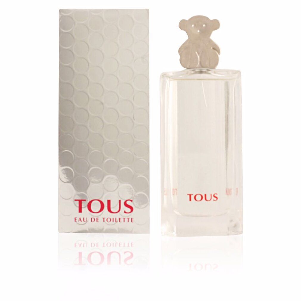 Parfümflakon und Schachtel. Flakon mit Bärenverschluss. Aufschrift: Tous Eau de Toilette. Silberne Schachtel mit Wabenmuster. Spiegelung.