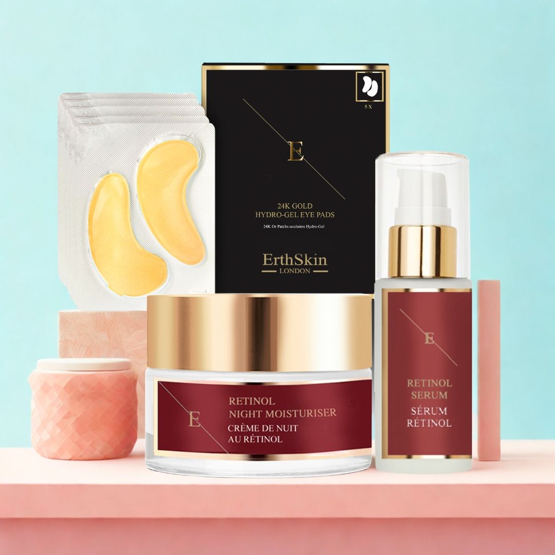 Set mit Augenpads, Nachtcreme und Serum. Goldfarbene Augenpads, Creme- und Serumflaschen mit Etiketten. Schwarze Verpackung mit Logo.