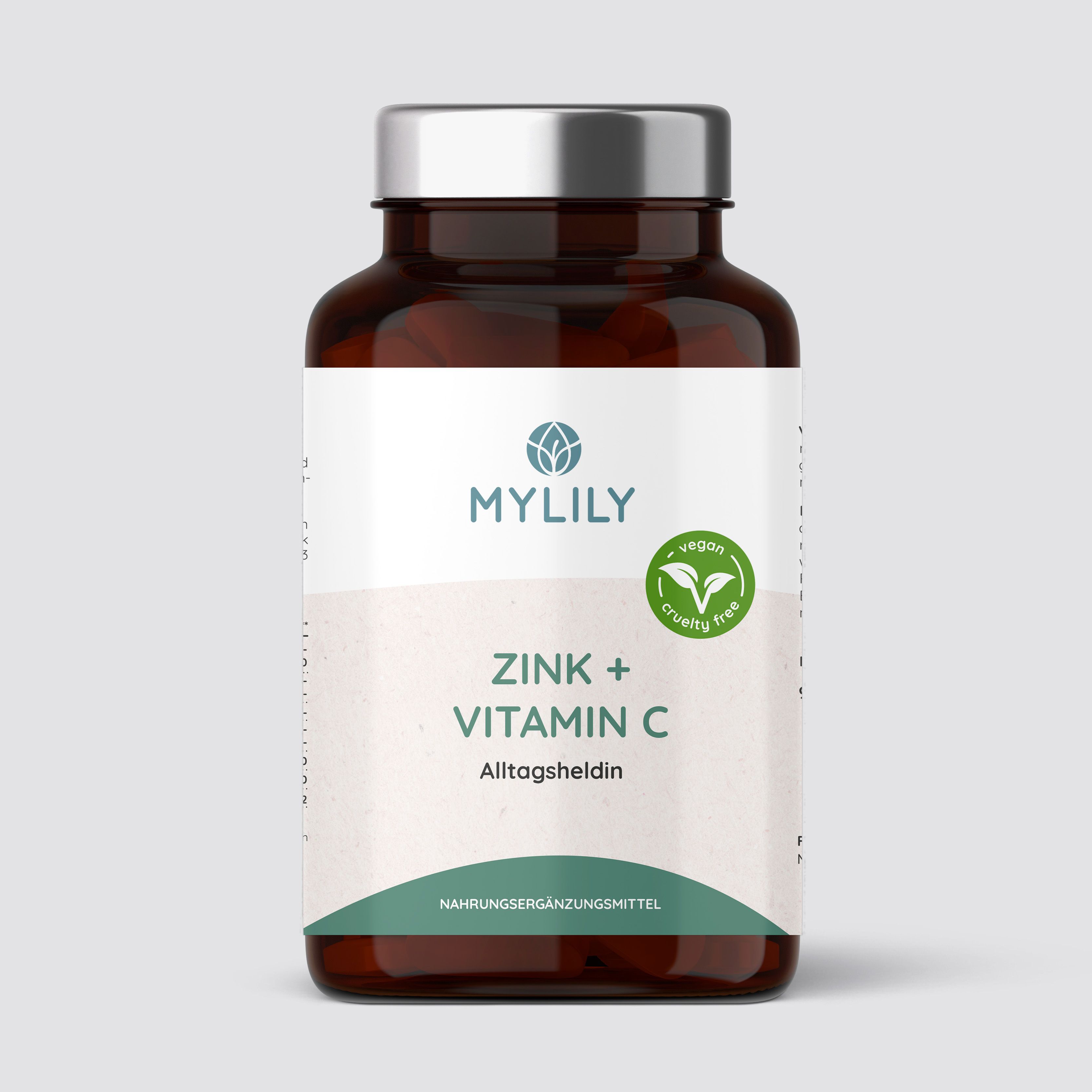 Braune Flasche mit weißem Etikett. Aufschrift: MYLILY, Zink + Vitamin C, Alltagsheldin. Vegan-Siegel.
