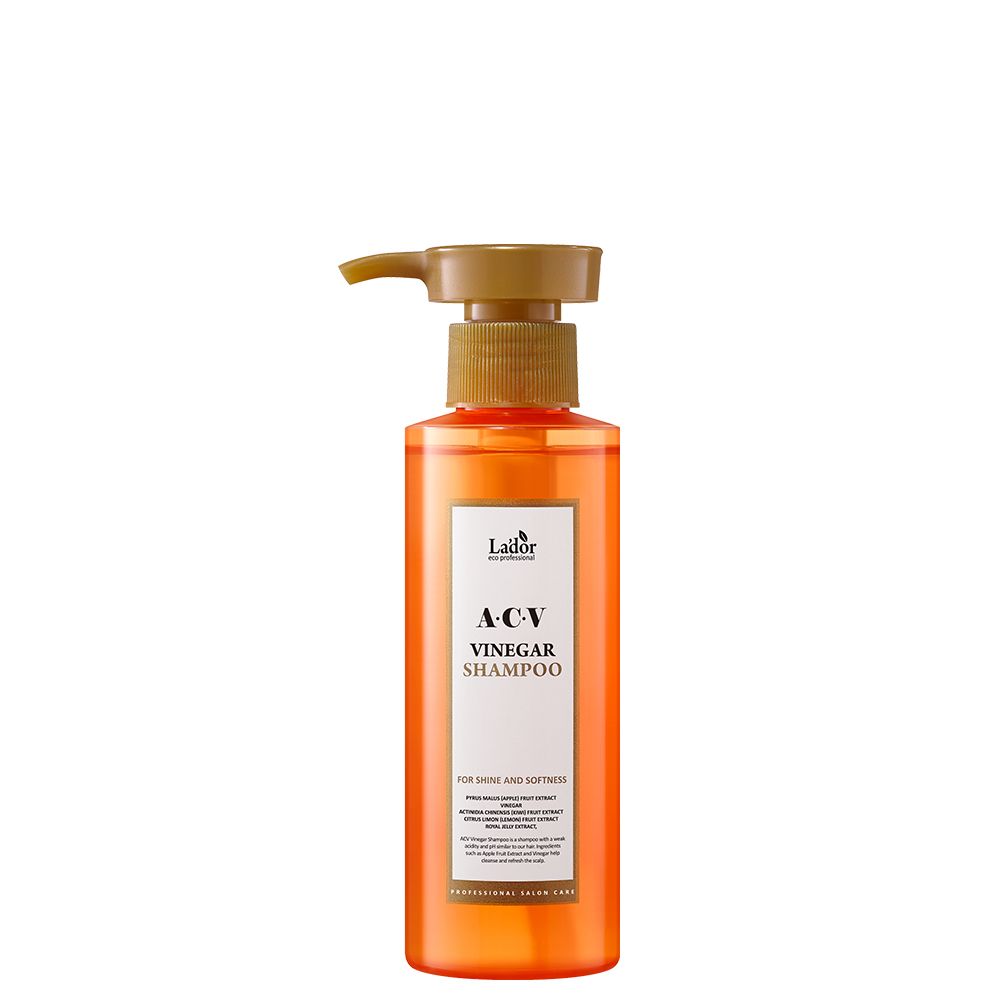 Orangefarbene Flasche mit Pumpspender, Lador A-CV Essig-Shampoo für Glanz und Geschmeidigkeit.