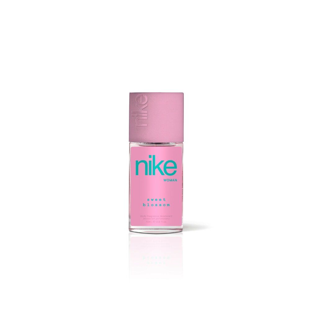 Rosa Deodorant-Zerstäuber. Aufschrift "nike" in Türkis. "sweet blossom" und "woman" auf dem Etikett. Rosa Verschlusskappe mit "nike" Prägung.