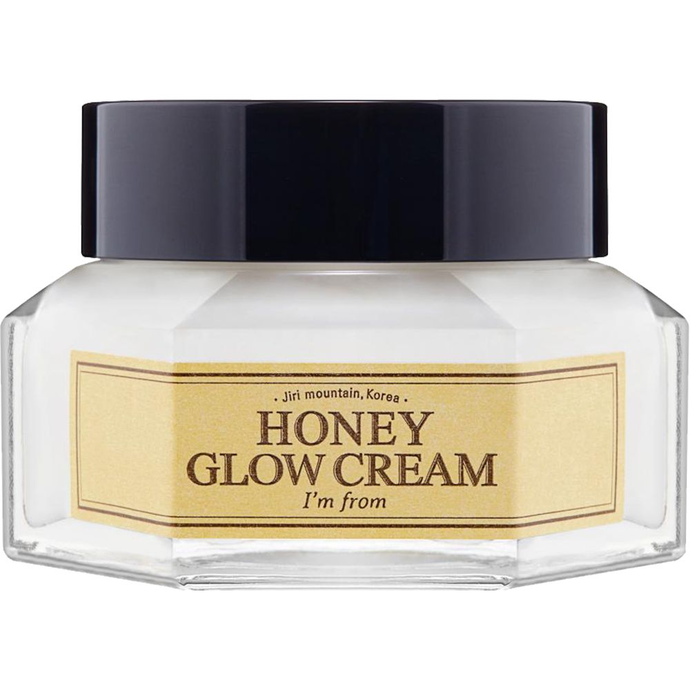 Creme-Glas mit schwarzem Deckel. Aufschrift: HONEY GLOW CREAM, I'm from. Gelbes Etikett. Sechseckige Form.