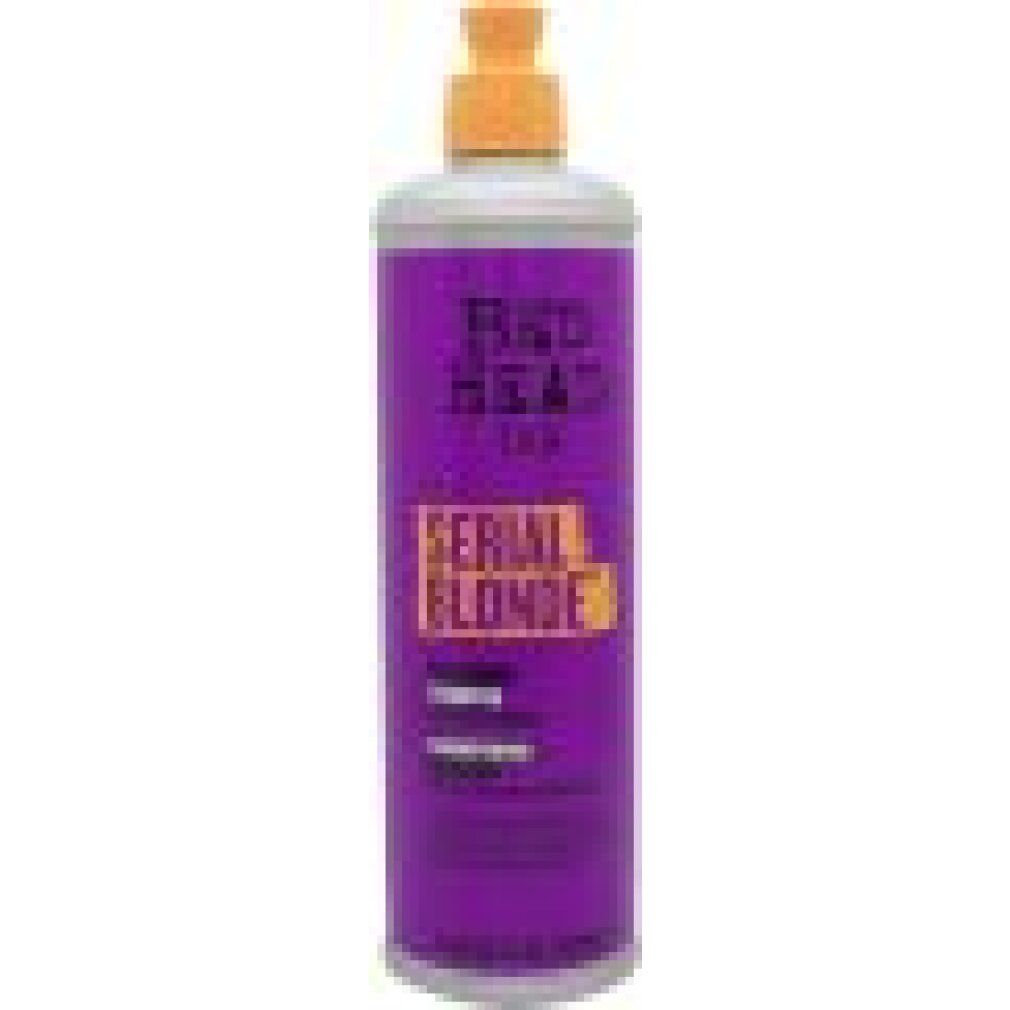 Violette Shampoooflasche mit gelbem Deckel. Aufschrift: Bed Head Tigi Serial Blonde. Restoring Shampoo.