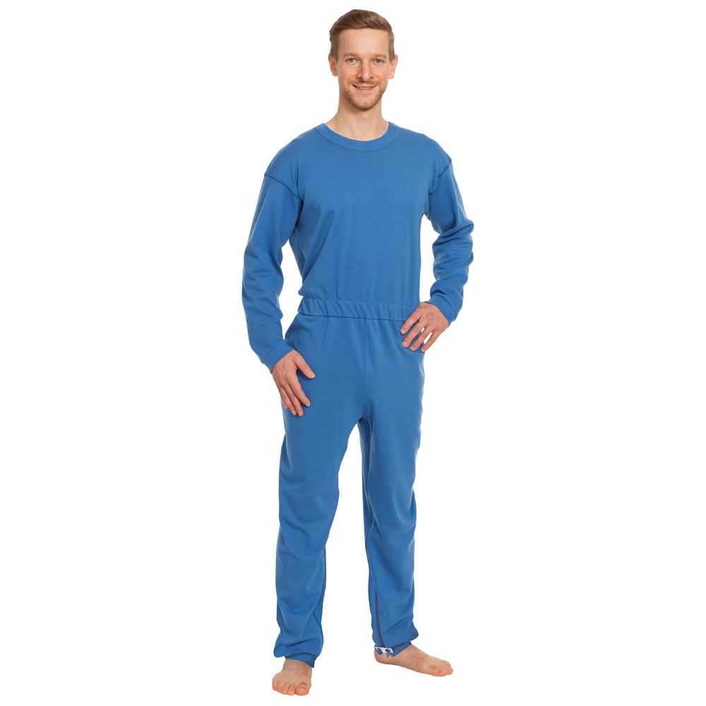 Eine Person trägt einen blauen Pflegeoverall. Langärmlig, mit Bündchen an Hand- und Fußgelenken. Elastischer Bund.