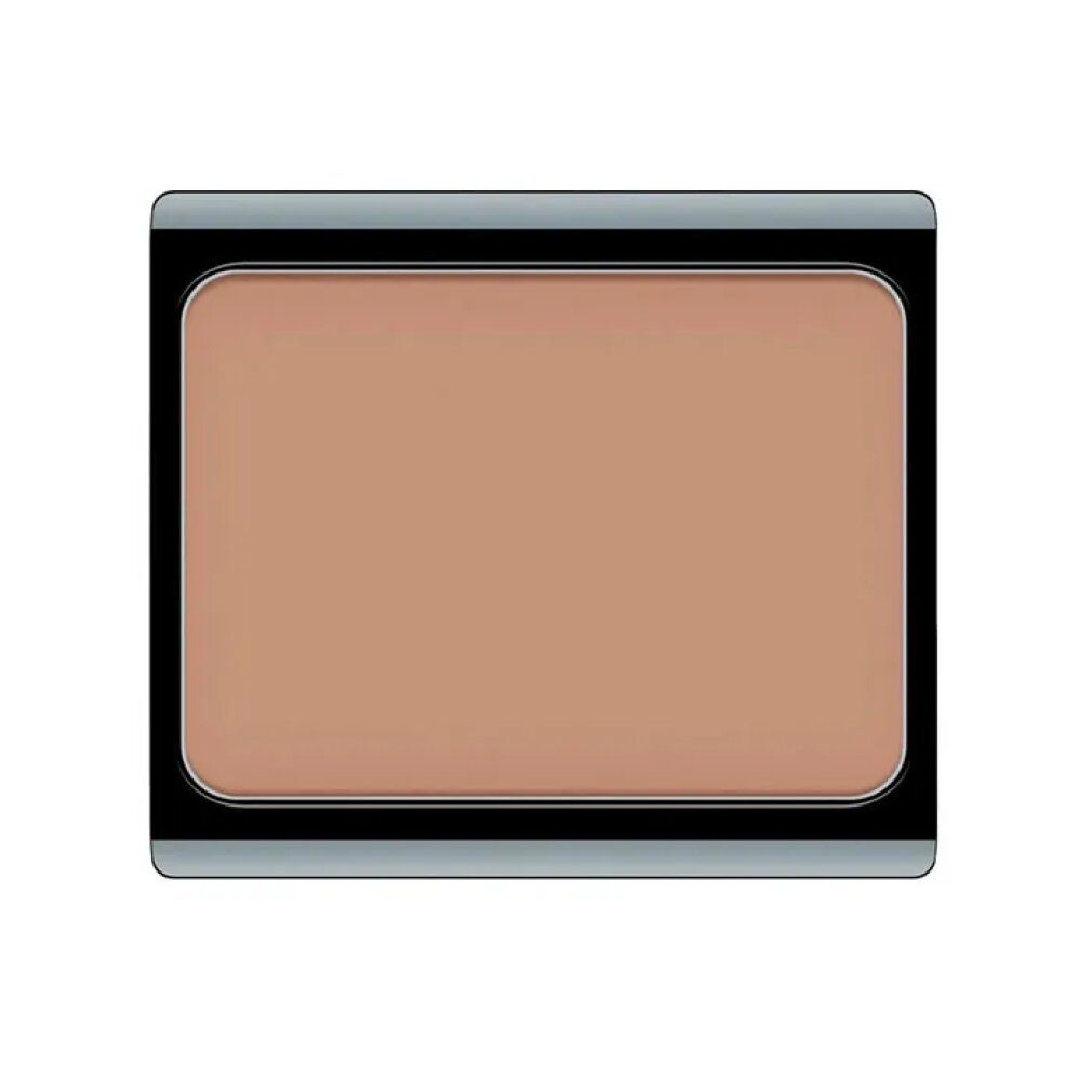 Kompakt-Make-up in einem schwarzen Behälter mit silberfarbenem Rand. Beige Creme.
