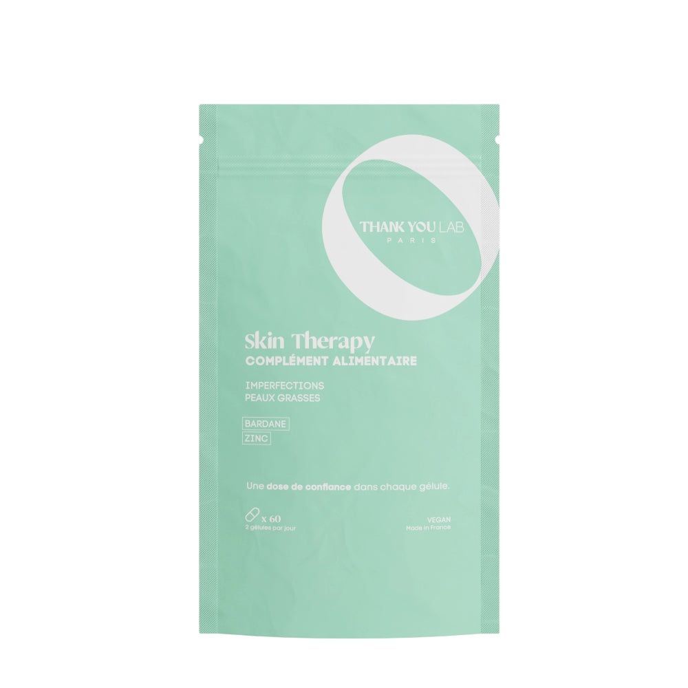 Grüne Verpackung mit Produktnamen und Text. Text: Skin Therapy, Complément Alimentaire, Imperfections, Peaux Grasses.